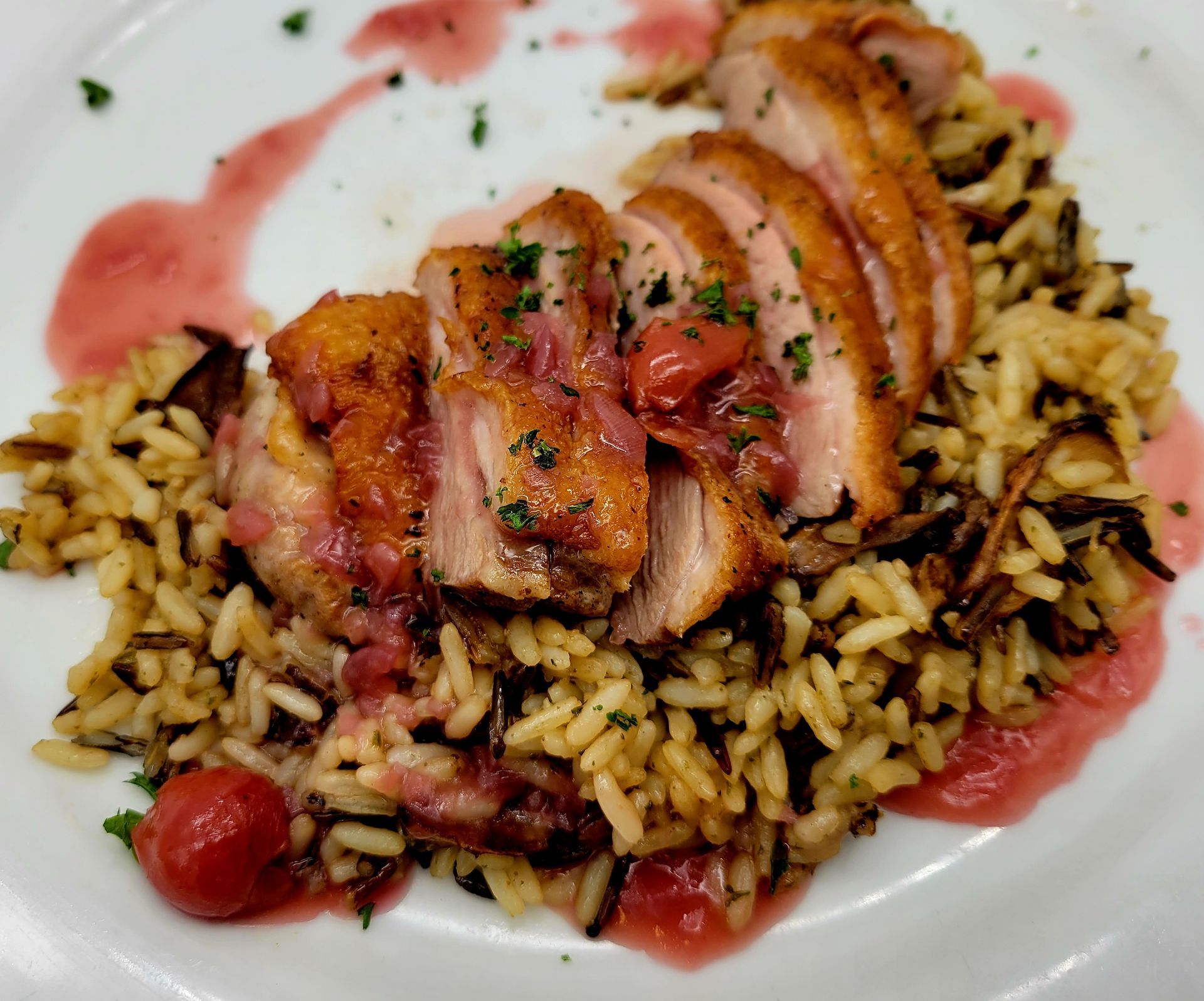 A plate of food with rice and meat on it