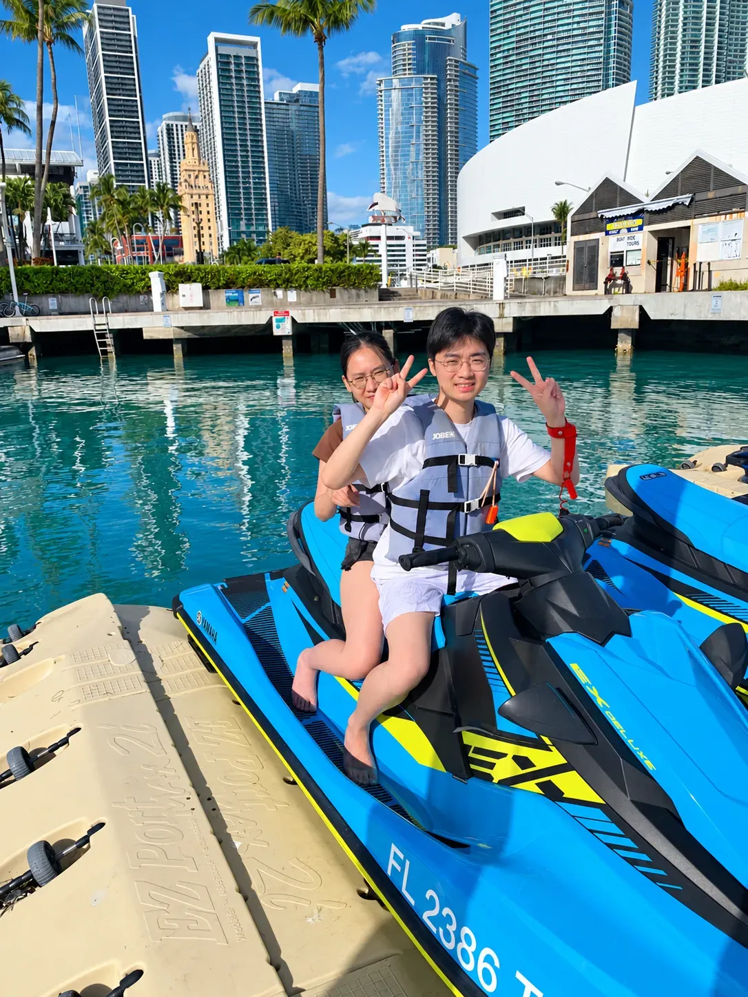 Couple departing on Miami guided jet ski rentals from Bayside Marketplace