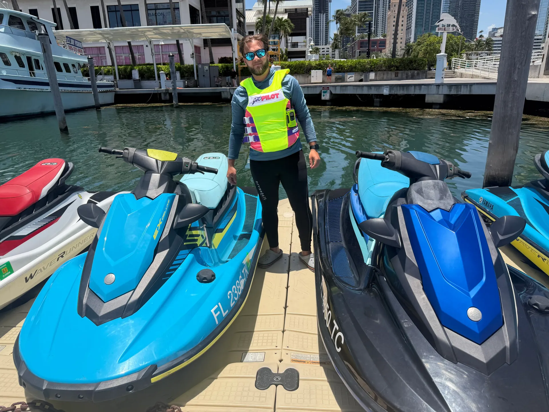 Miami guided jet ski tours guide standing with jet skis at Bayside Marina in Downtown Miami
