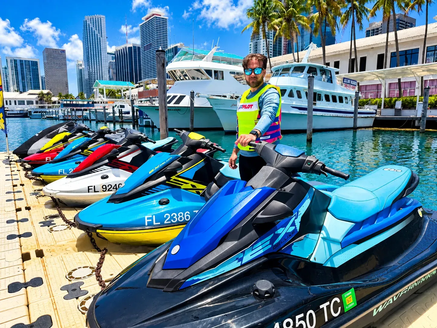 Miami jet ski tours guide preparing jet skis for riders at Bayside Marina in Downtown Miami