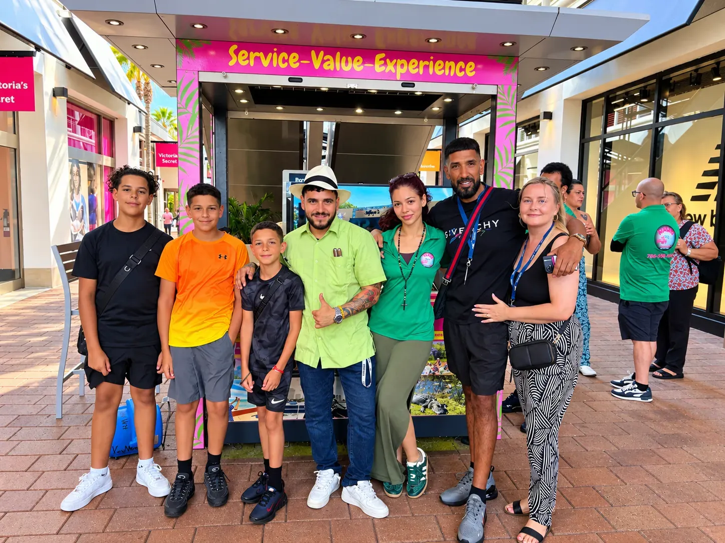 Miami tours and rentals group posing with the local team at Bayside Marketplace in Downtown Miami
