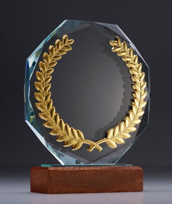 A Glass Plaque with a Gold Laurel Wreath on It — Ace Wholesale Trophies & Engraving In Bowen, QLD