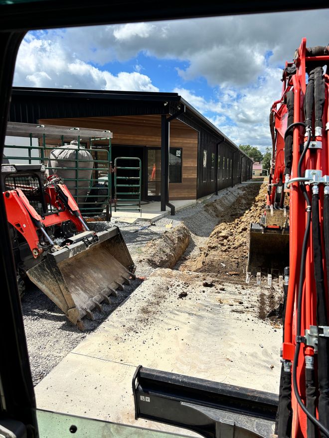 Two excavators at residential yard