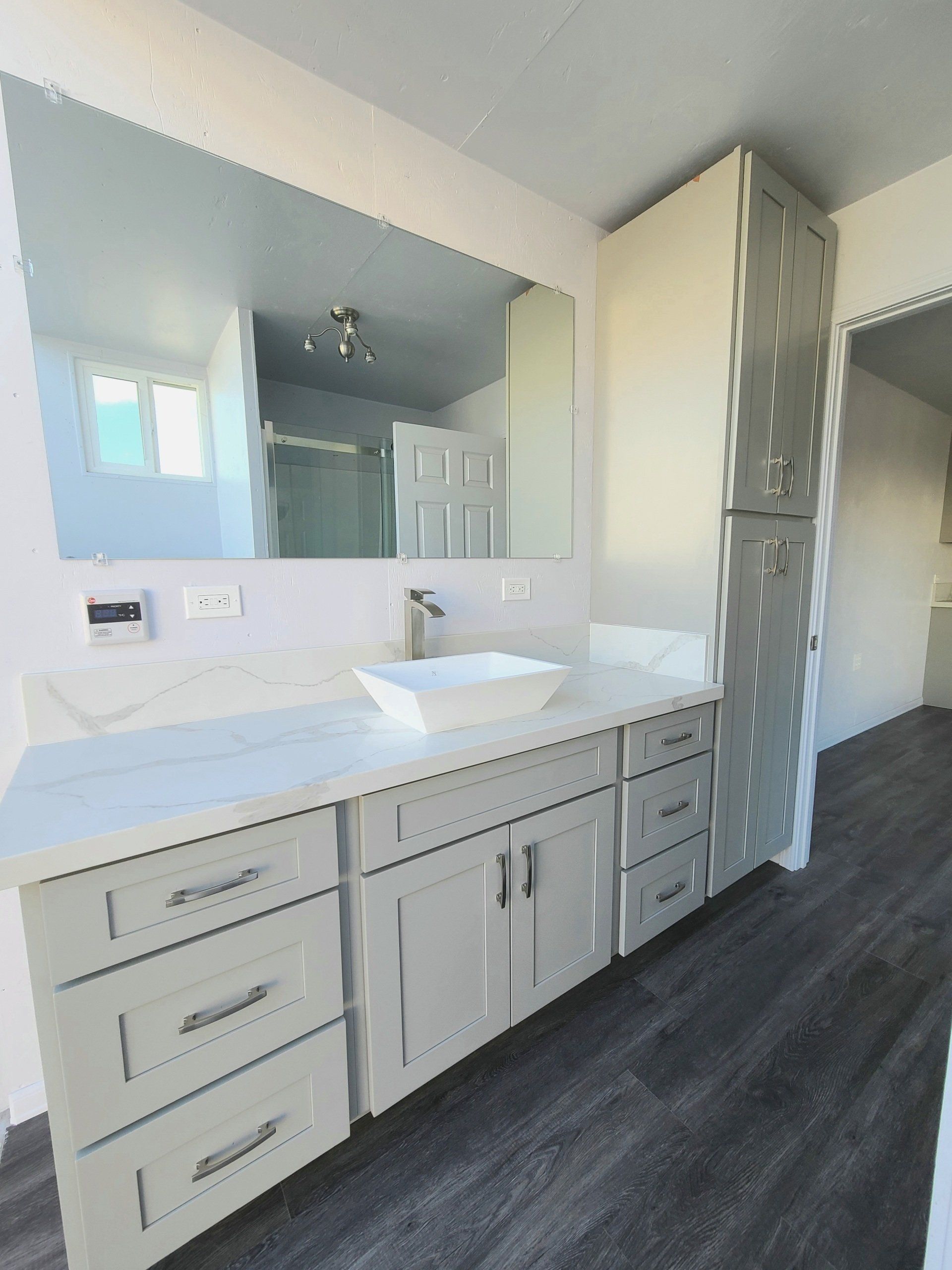 Custom Shipping Container Interior with custom bathroom sink and drawers