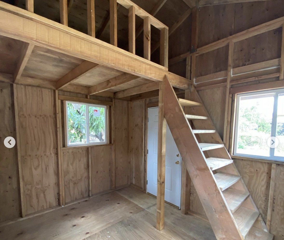 Studio Shed interior with loft and stairs