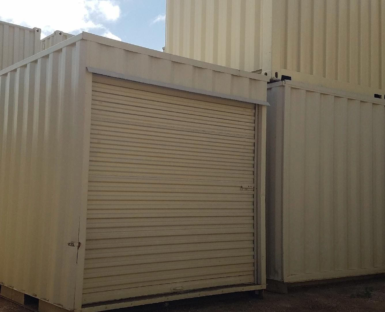 Shipping Container Storage Solution with rollup door and beige exterior
