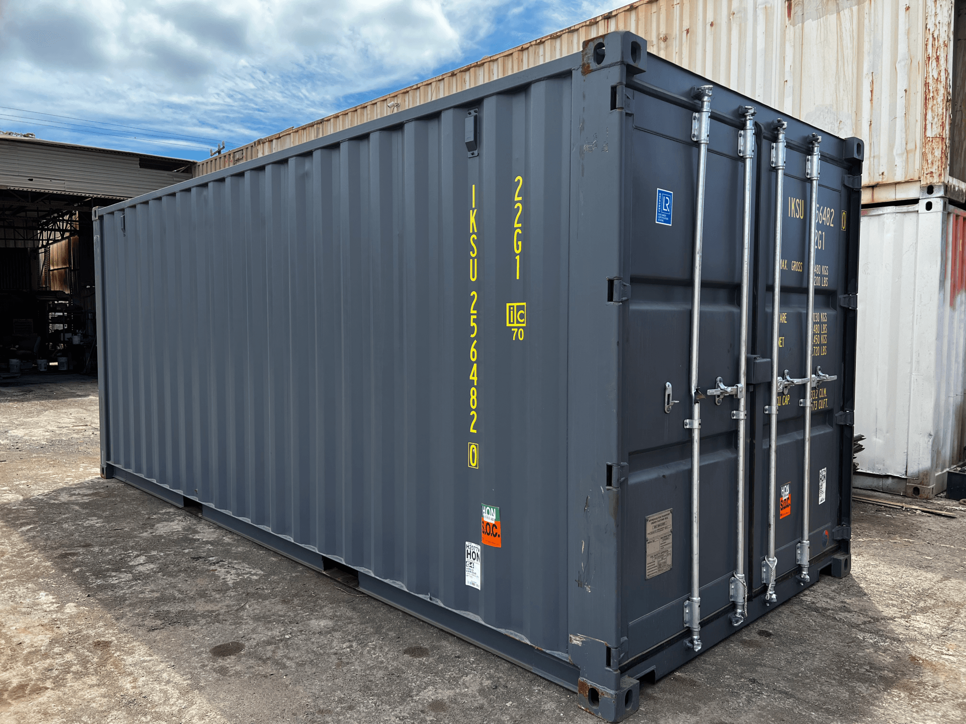 New (One Trip) 20' Standard Height Shipping Container exterior with grey paint and doors