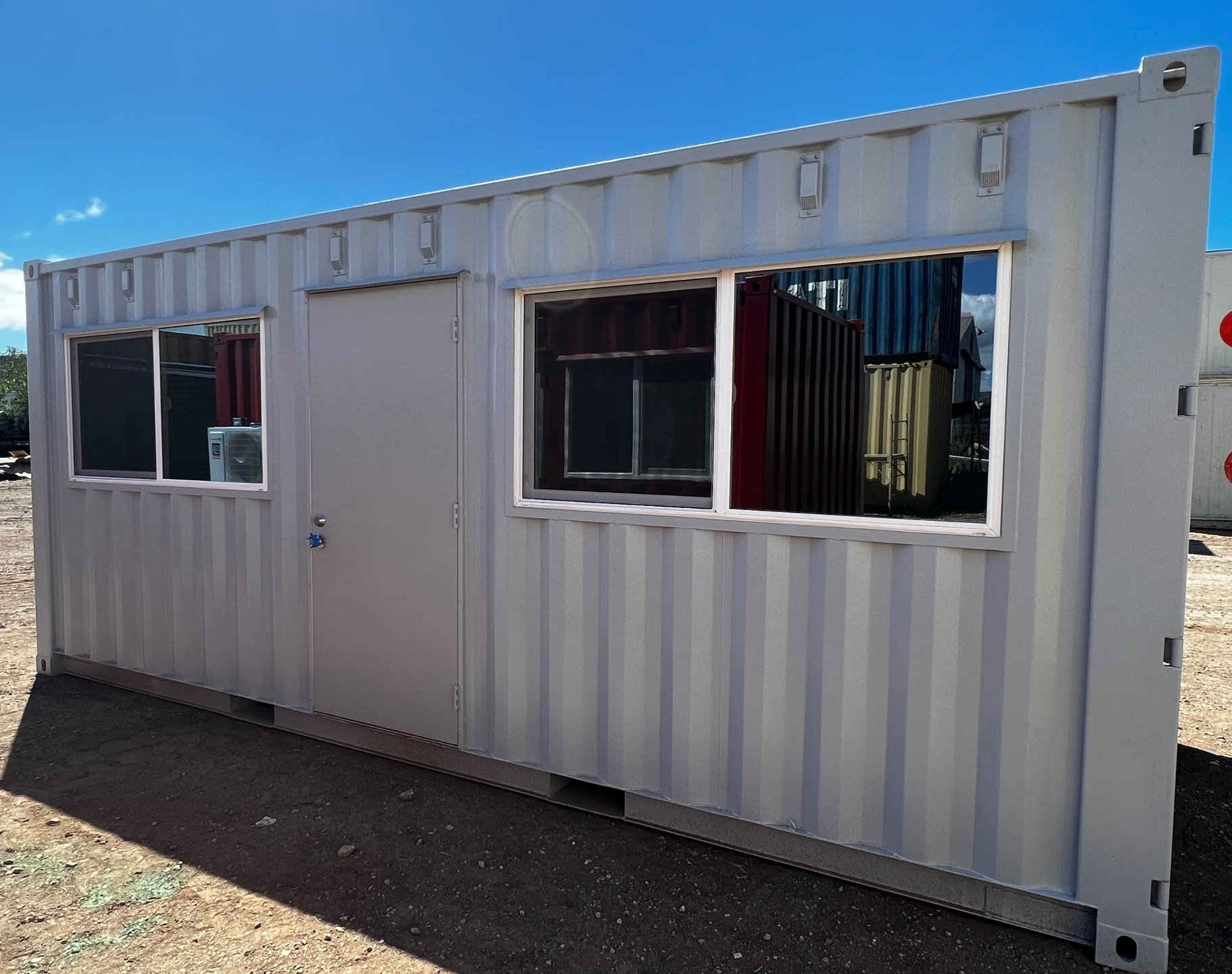 20 ft. Mobile Office trailer with front door and two windows with grey exterior