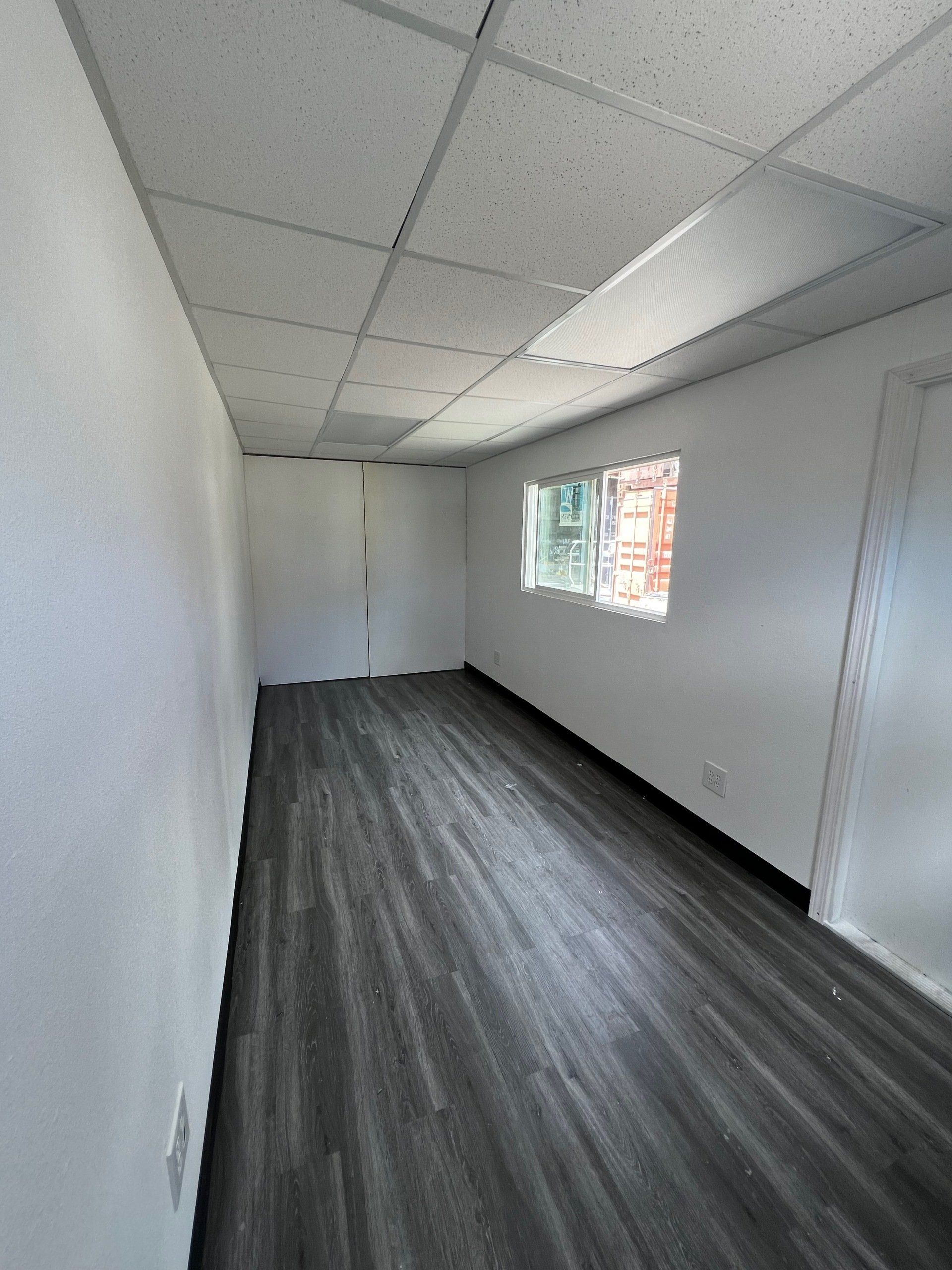 Deluxe Office Interiors with entrance and window and custom flooring