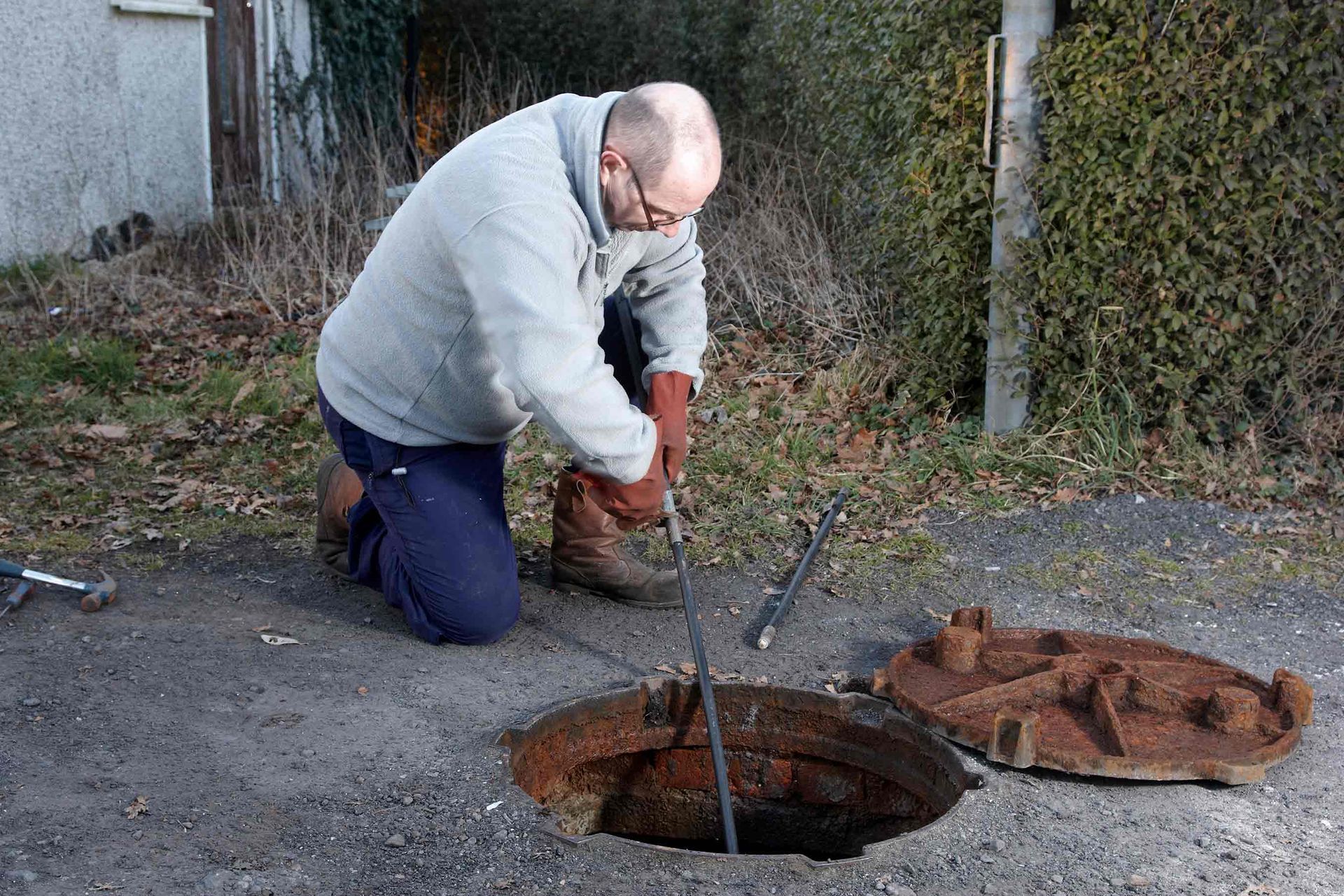 Man Clearing The Drains — Leicester, NC — Mike Septic Tank Services
