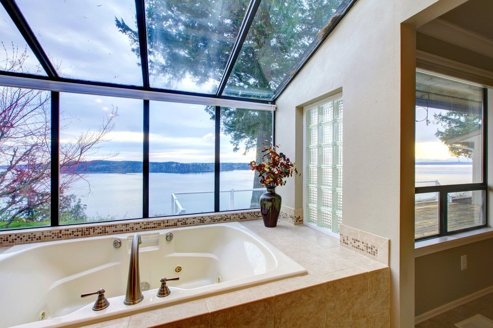 A Bathroom With a Jacuzzi Tub and a View of the Ocean — Glen Lamberts Wall Cladding & Home Improvements in Gloucester, NSW