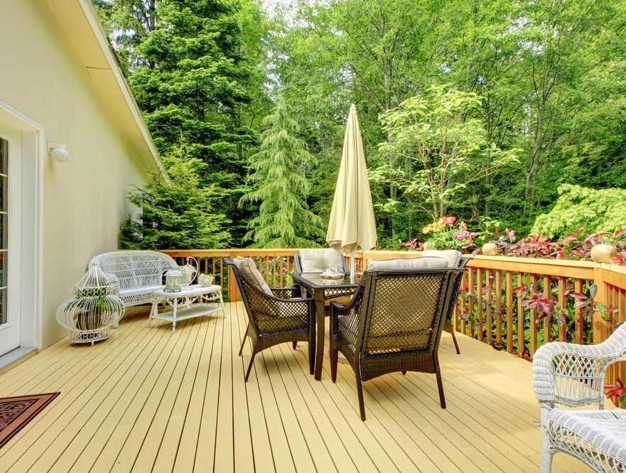 There is a Large Deck With a Table and Chairs on It — Glen Lamberts Wall Cladding & Home Improvements in Bulahdelah, NSW