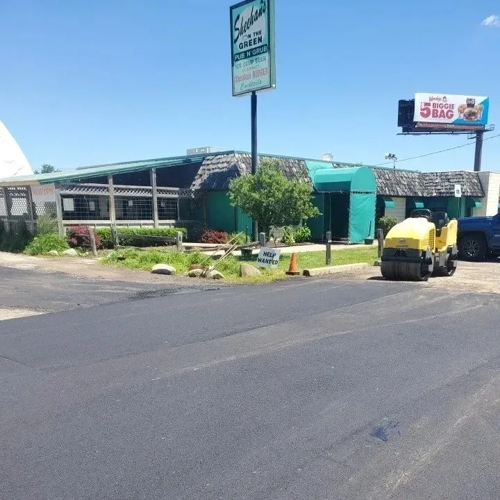 Parking lot asphalt paving and roller, DJs Paving, Canton, MI.