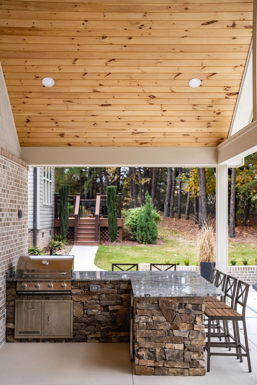 Outdoor kitchen with BullBBQ grill and natural stone. 