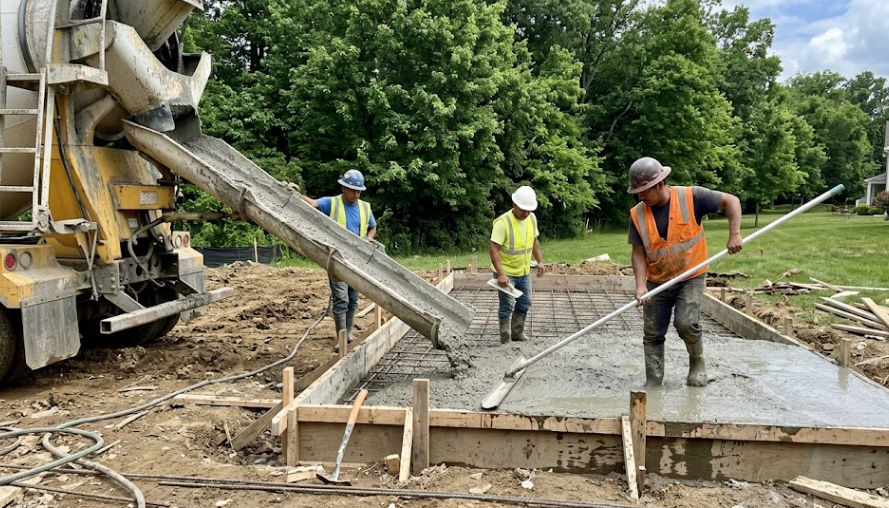 Pro Concrete Harrisonburg contractors pouring a new residential slab foundation for a local home.