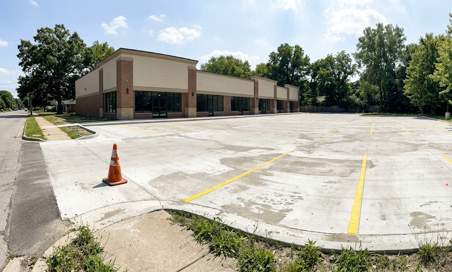 Freshly poured commercial concrete parking lot with yellow lines at a retail store in Harrisonburg VA.