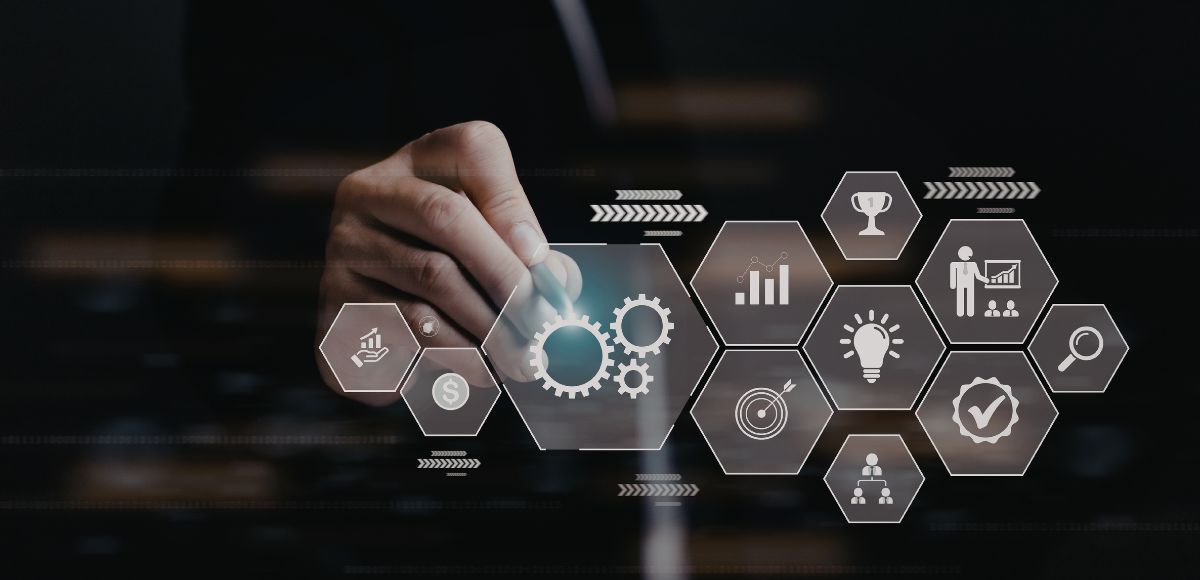 Businessman touching glowing tech icons and gears on a dark digital strategy