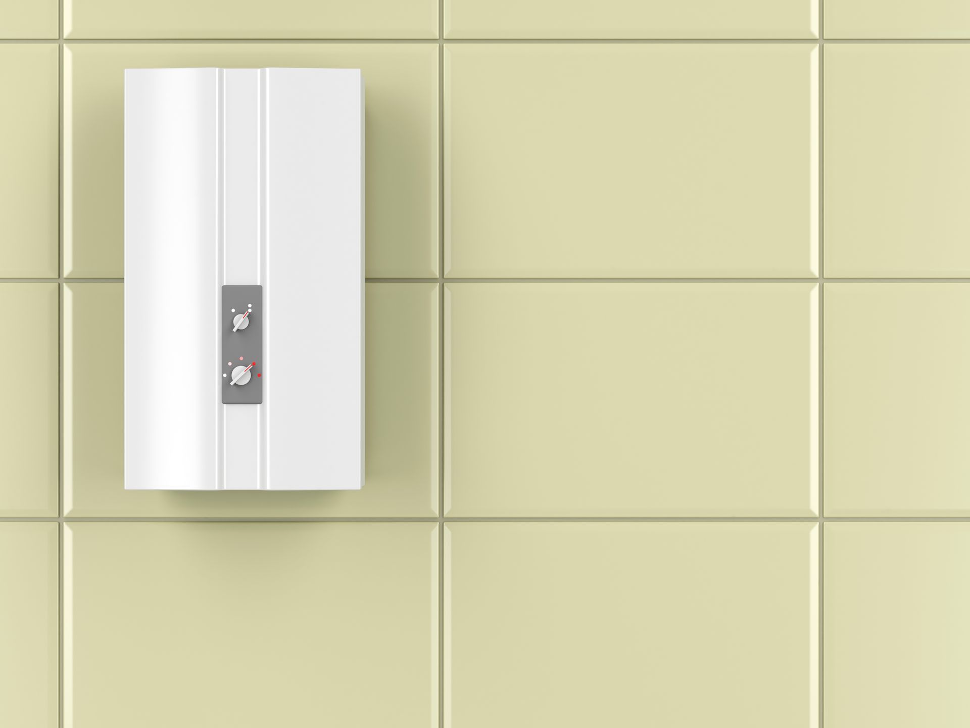 White water heater mounted on light yellow tiled wall.