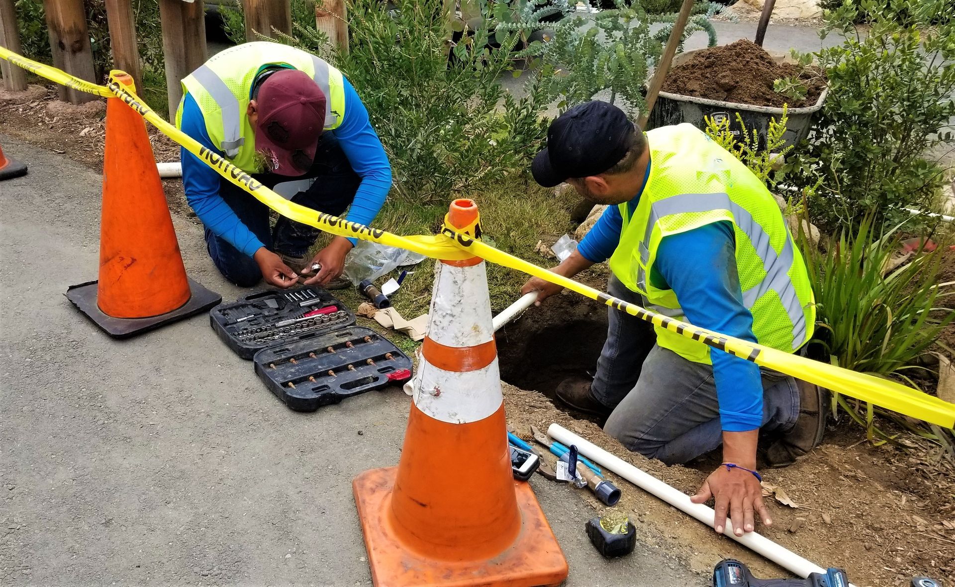 Professional plumbers doing an inspection.