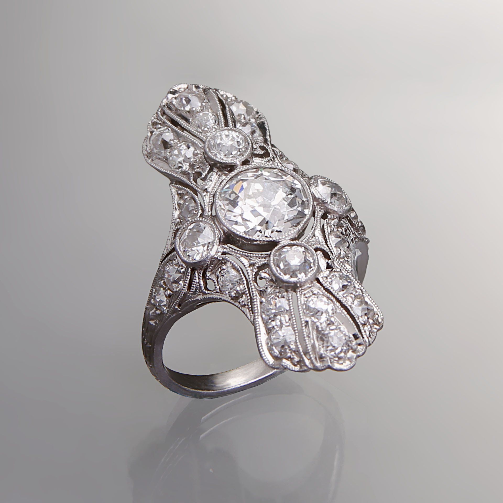 A silver ring with a lot of diamonds on it