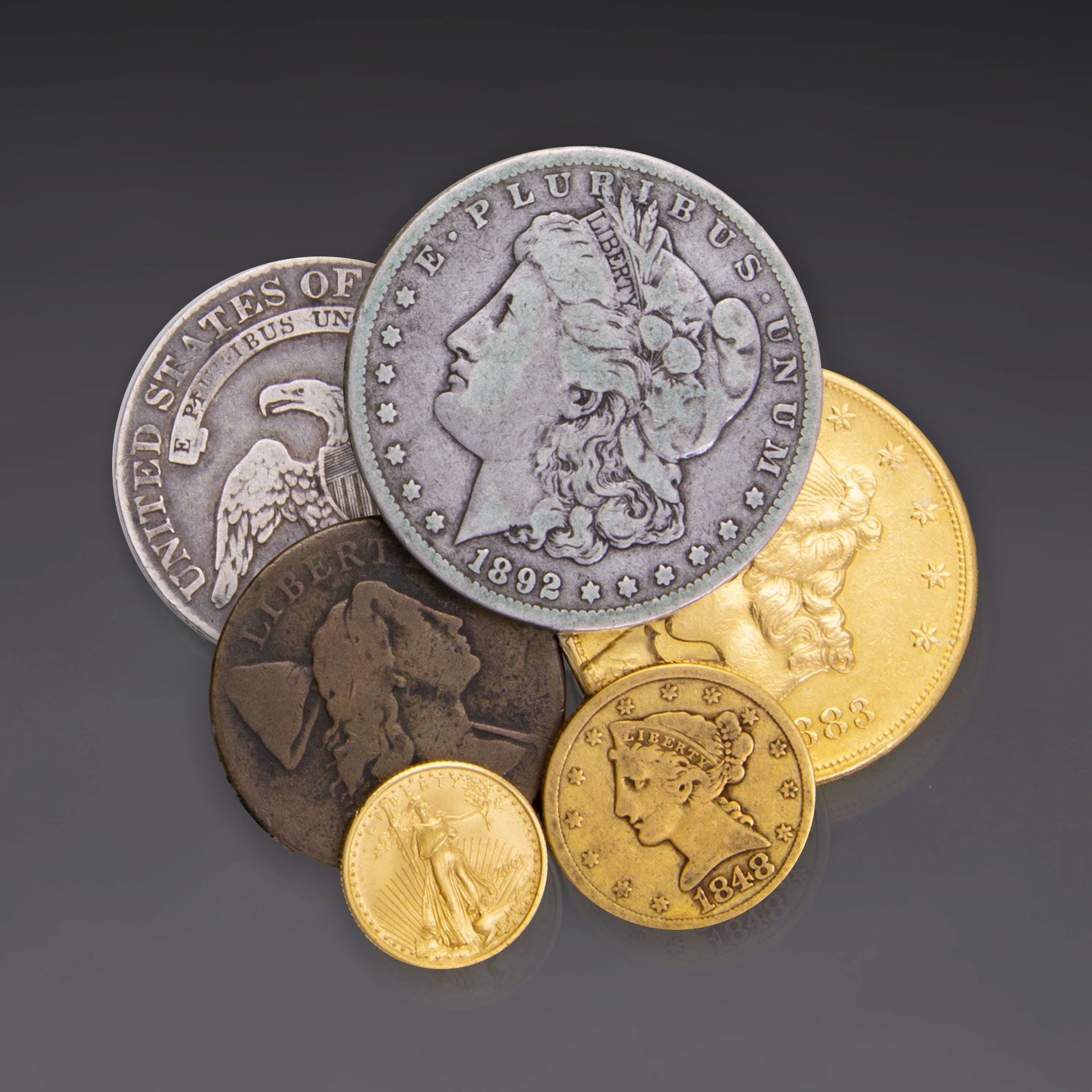 A bunch of coins with one that says liberty on it