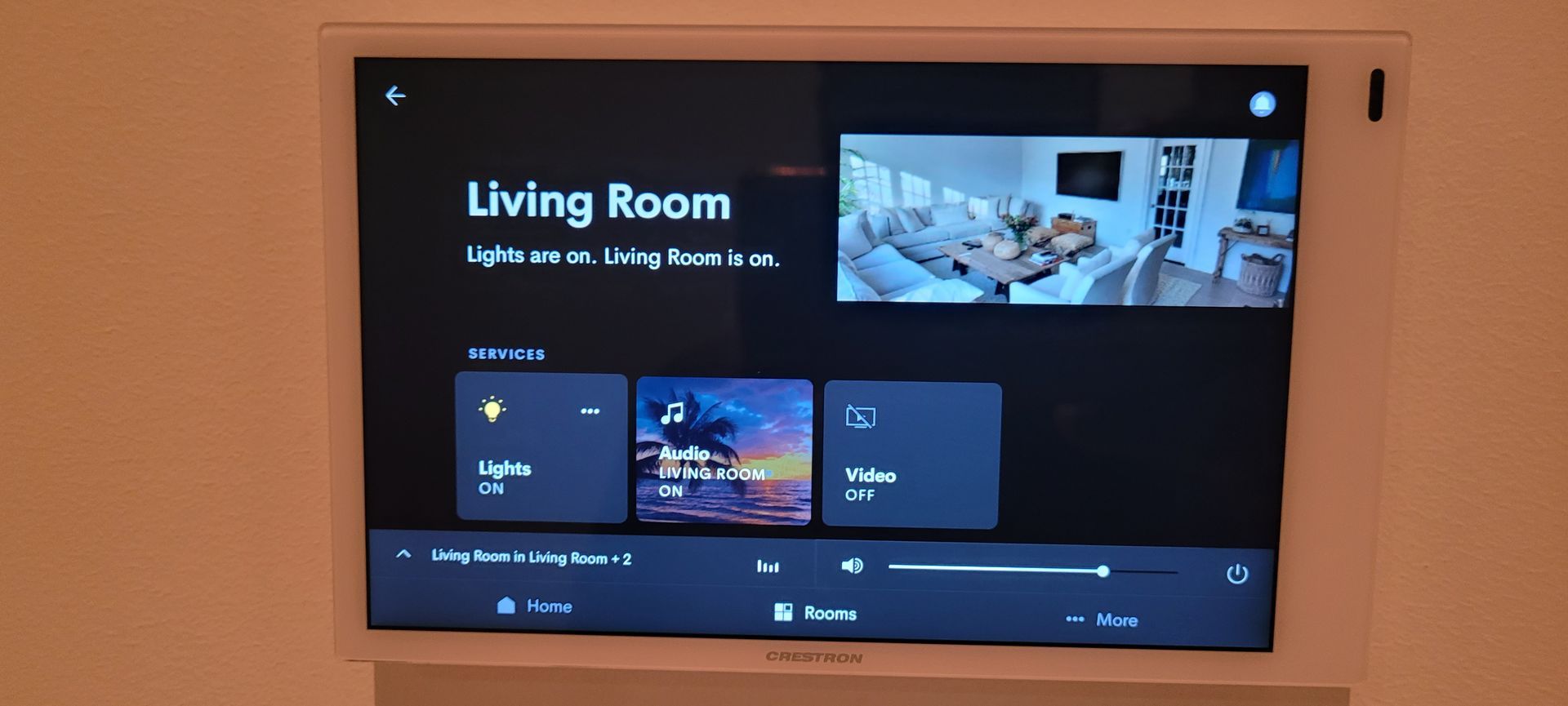 A smart tv is displaying a living room on the screen.
