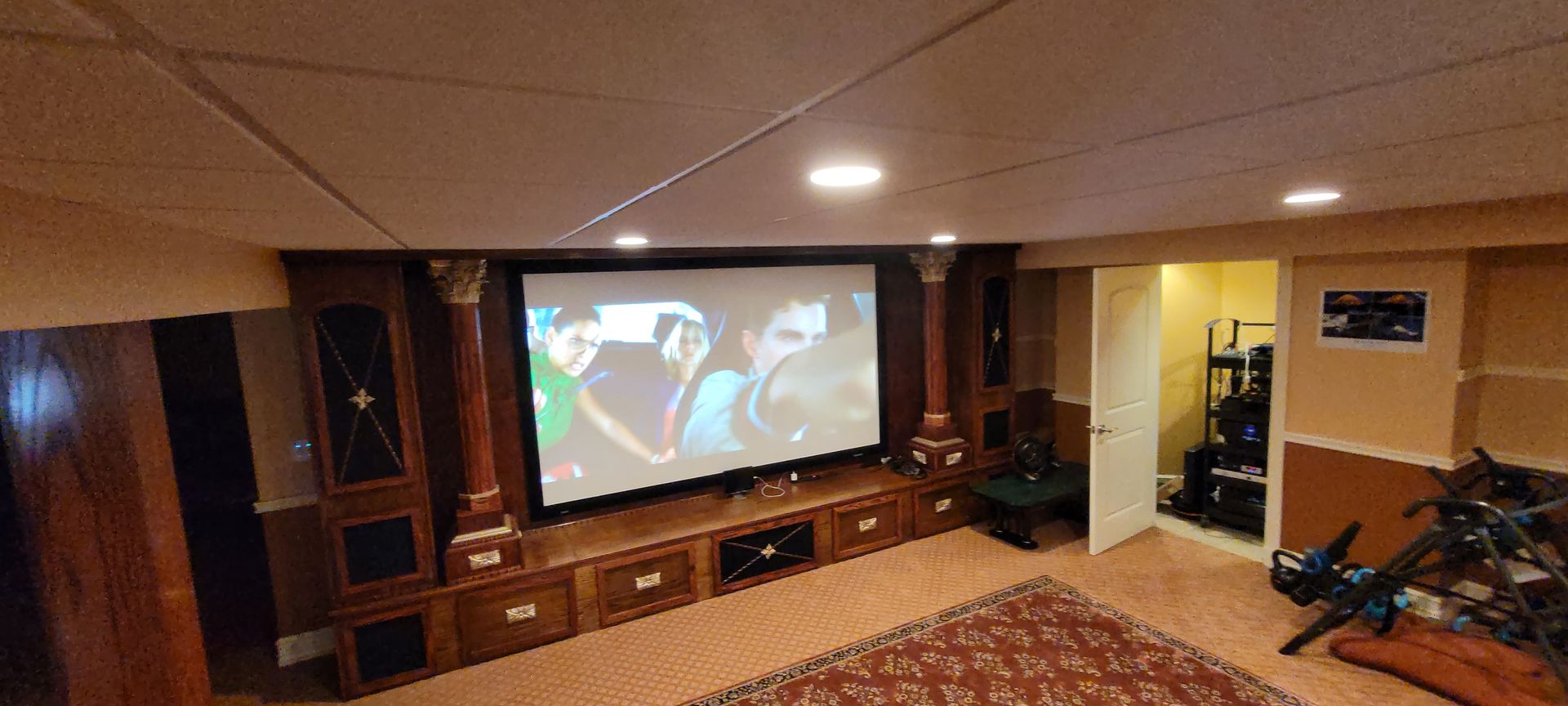 There is a large screen in the middle of the room.
