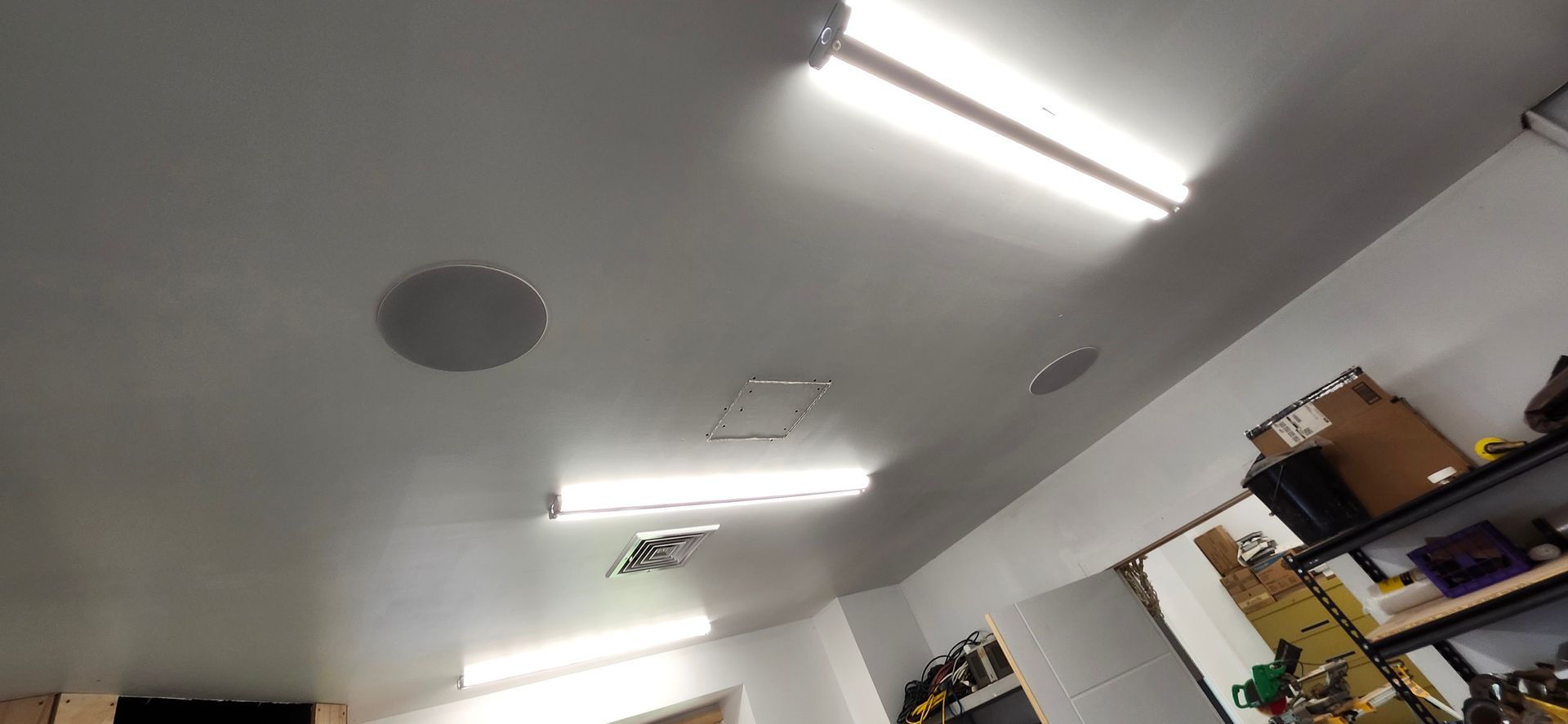 A room with a lot of lights on the ceiling.