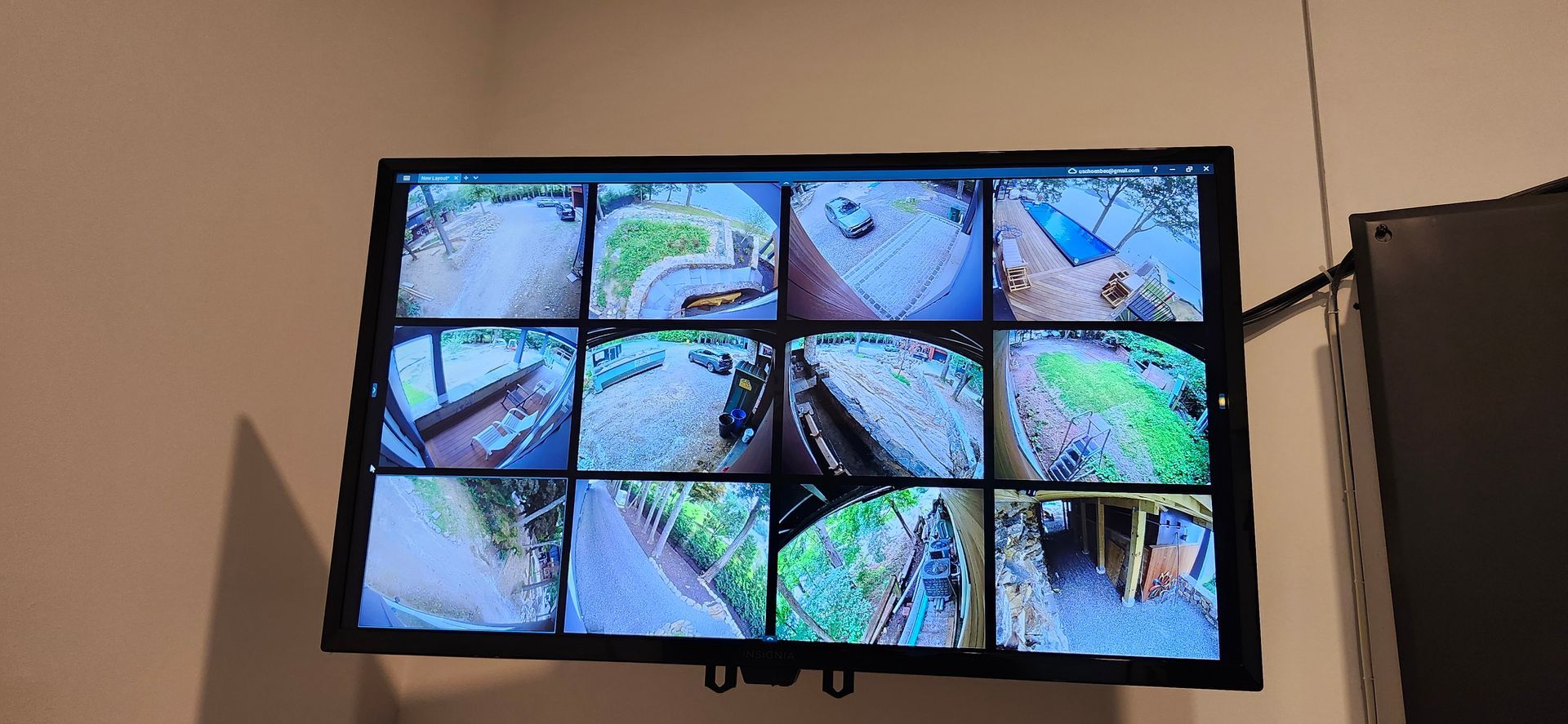 A large flat screen tv is hanging on a wall.