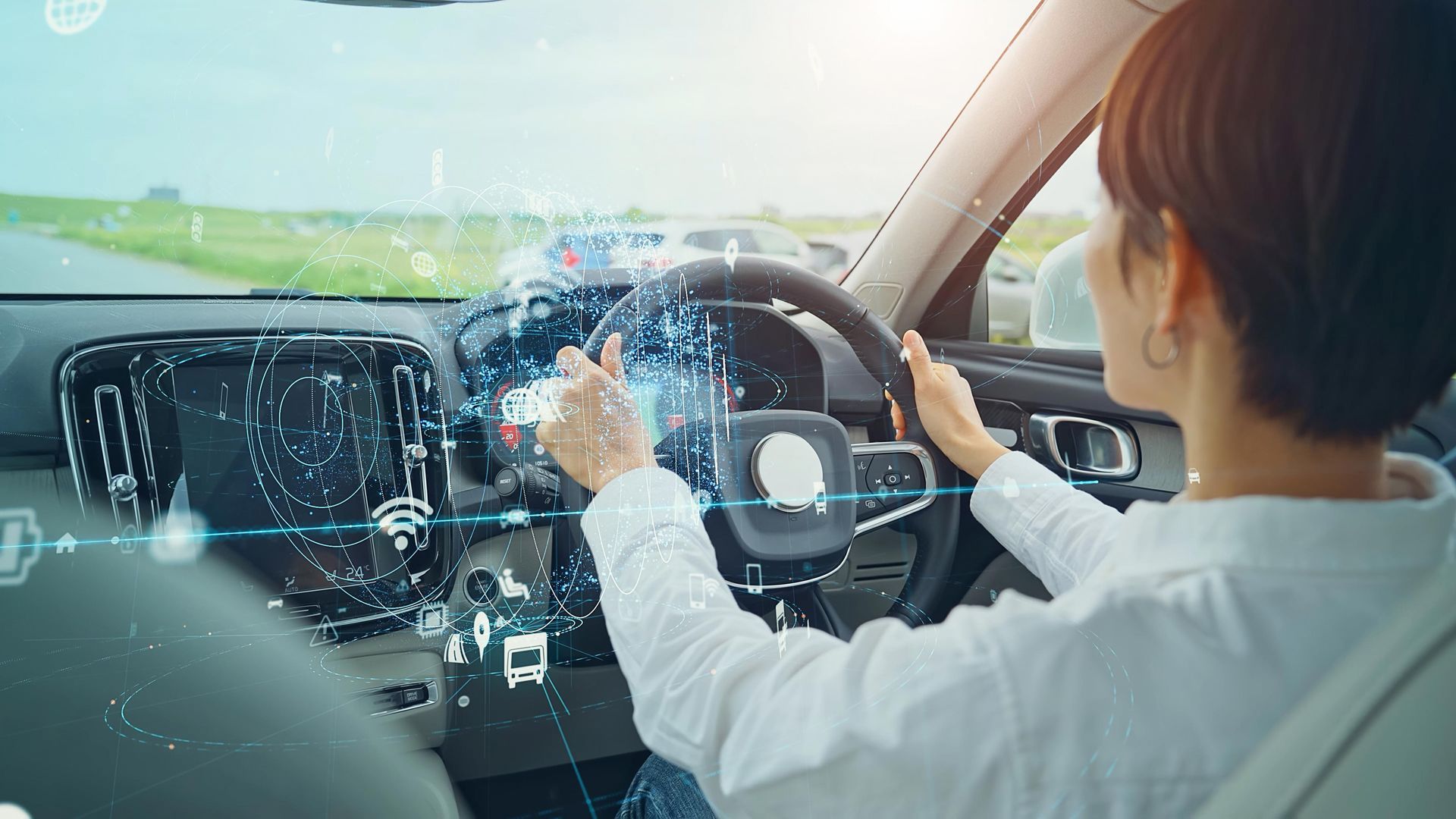 Woman Driving a Car With Digital Overlays — Road Runner Windscreens in South Grafton, NSW
