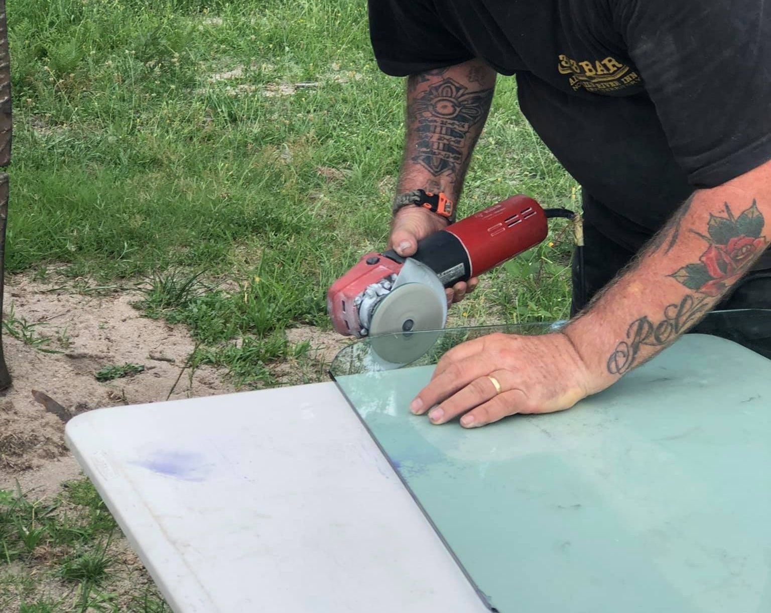 Man Carefully Cutting the Windshield for Replacement — Road Runner Windscreens in South Grafton, NSW