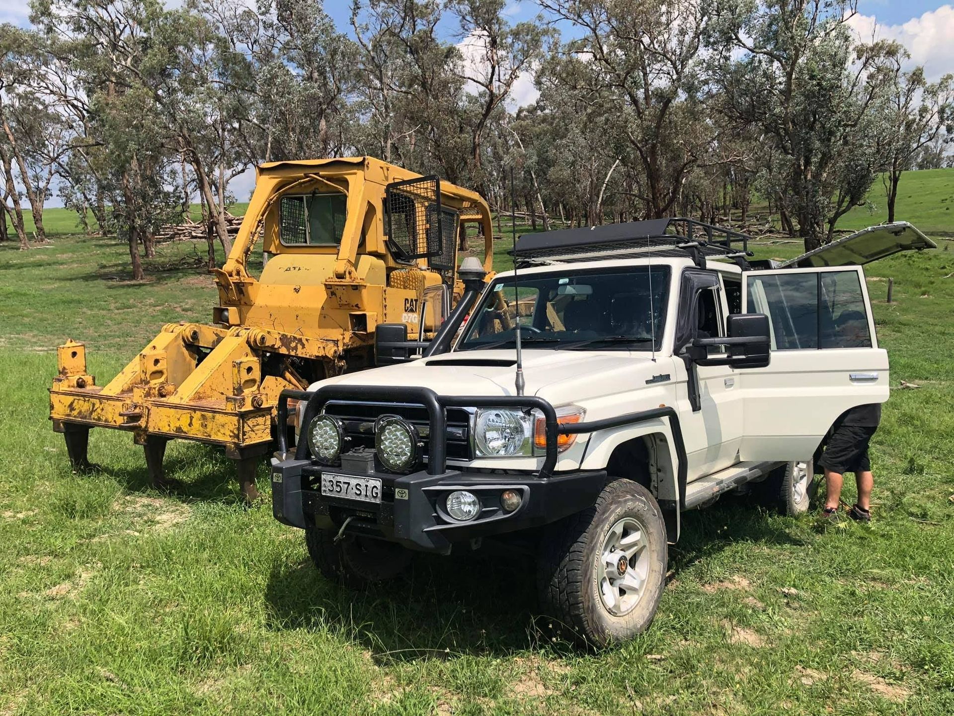 White Suv Next to Yellow Bulldozer — Road Runner Windscreens in South Grafton, NSW