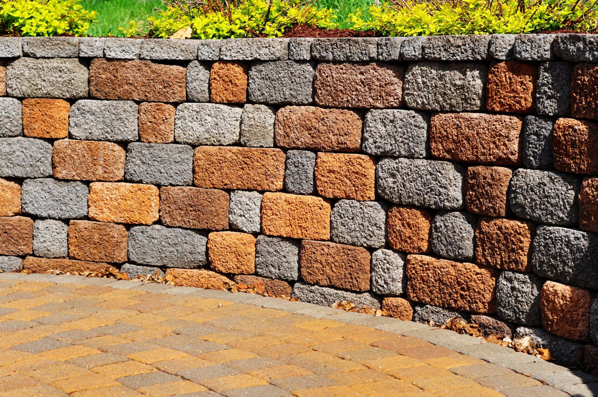 Coursed rubble masonry retaining wall