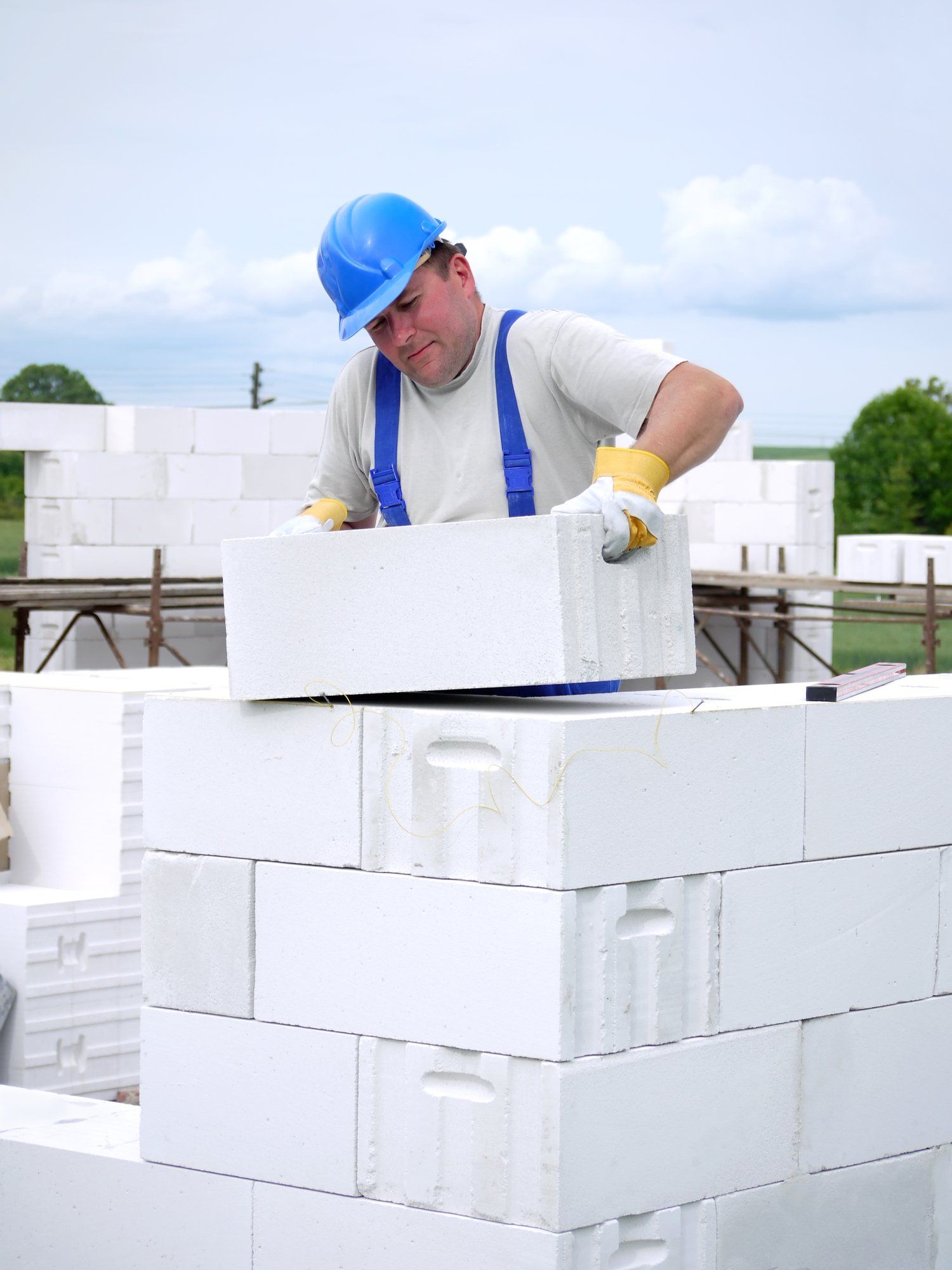 picture of cement blocks being laid by mason