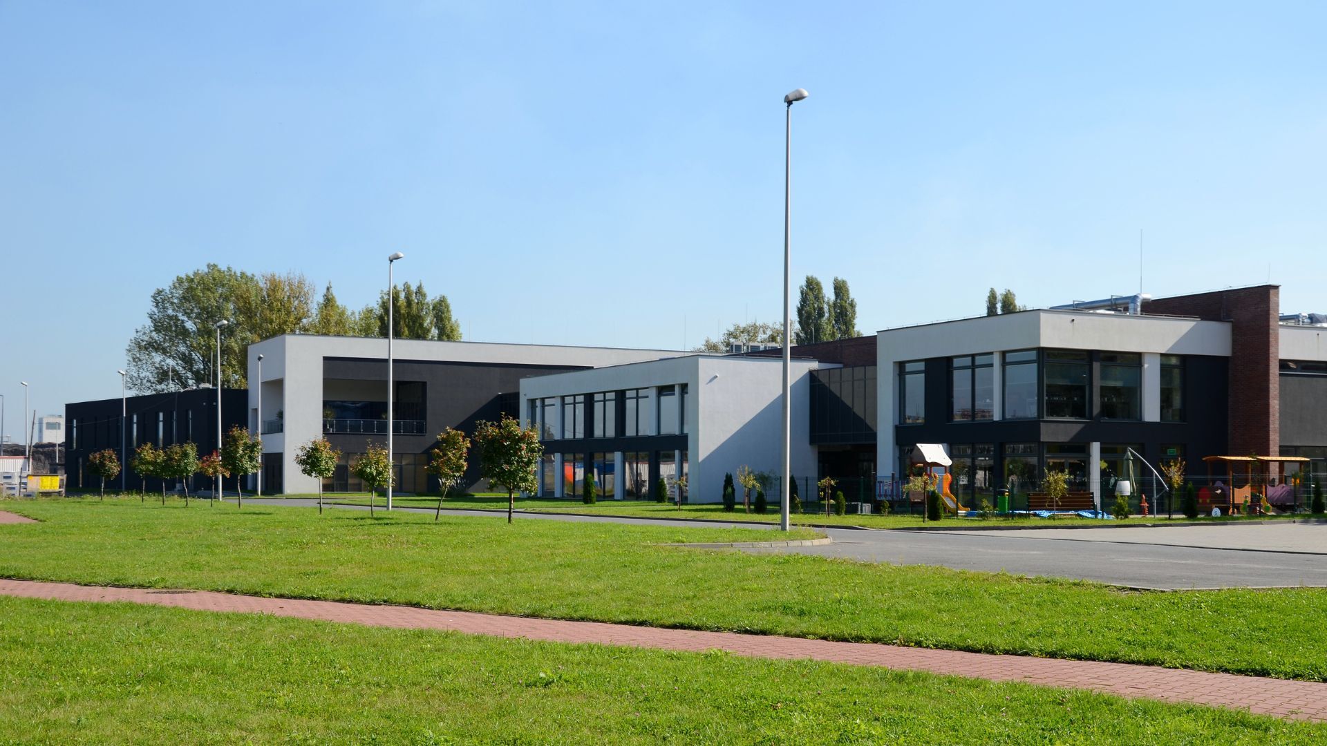 Modern school campus building — janitorial and custodial cleaning services for K-12 and higher education facilities