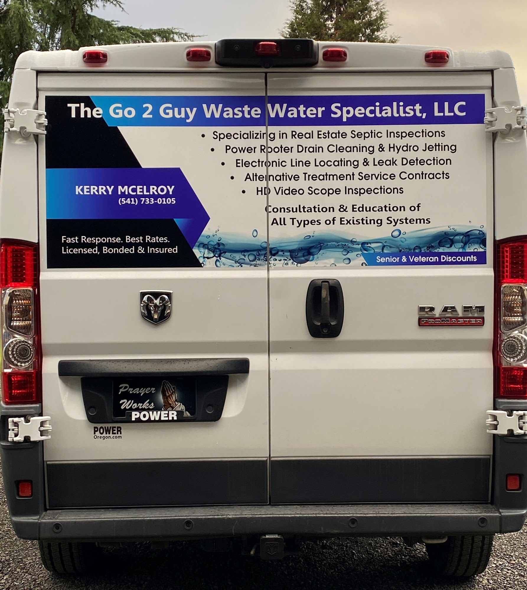 Back of a white RAM van with waste water service branding.