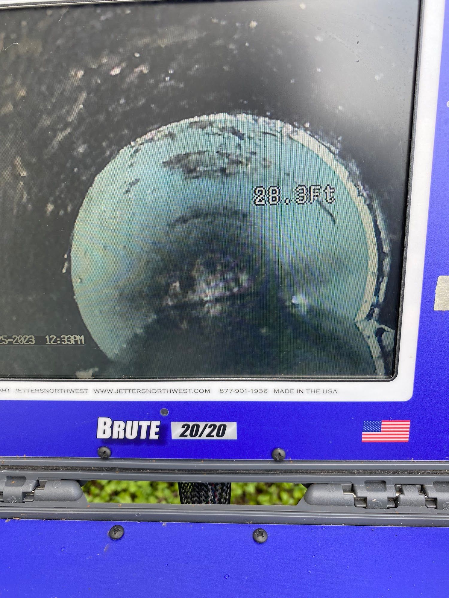Internal view of a pipe, showing a blueish coating, with a temperature reading of 28.8°F.