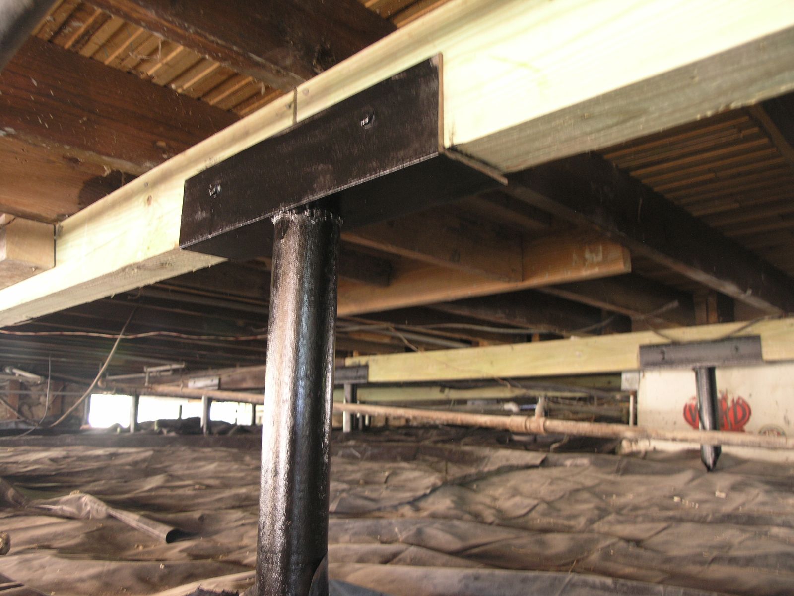 The bottom of a building with a few boxes on the floor
