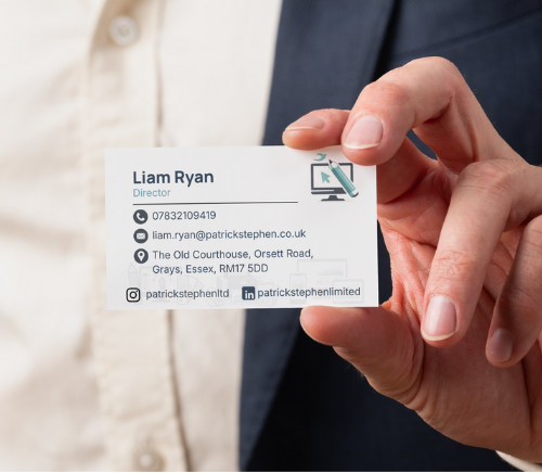 Person holding a business card for