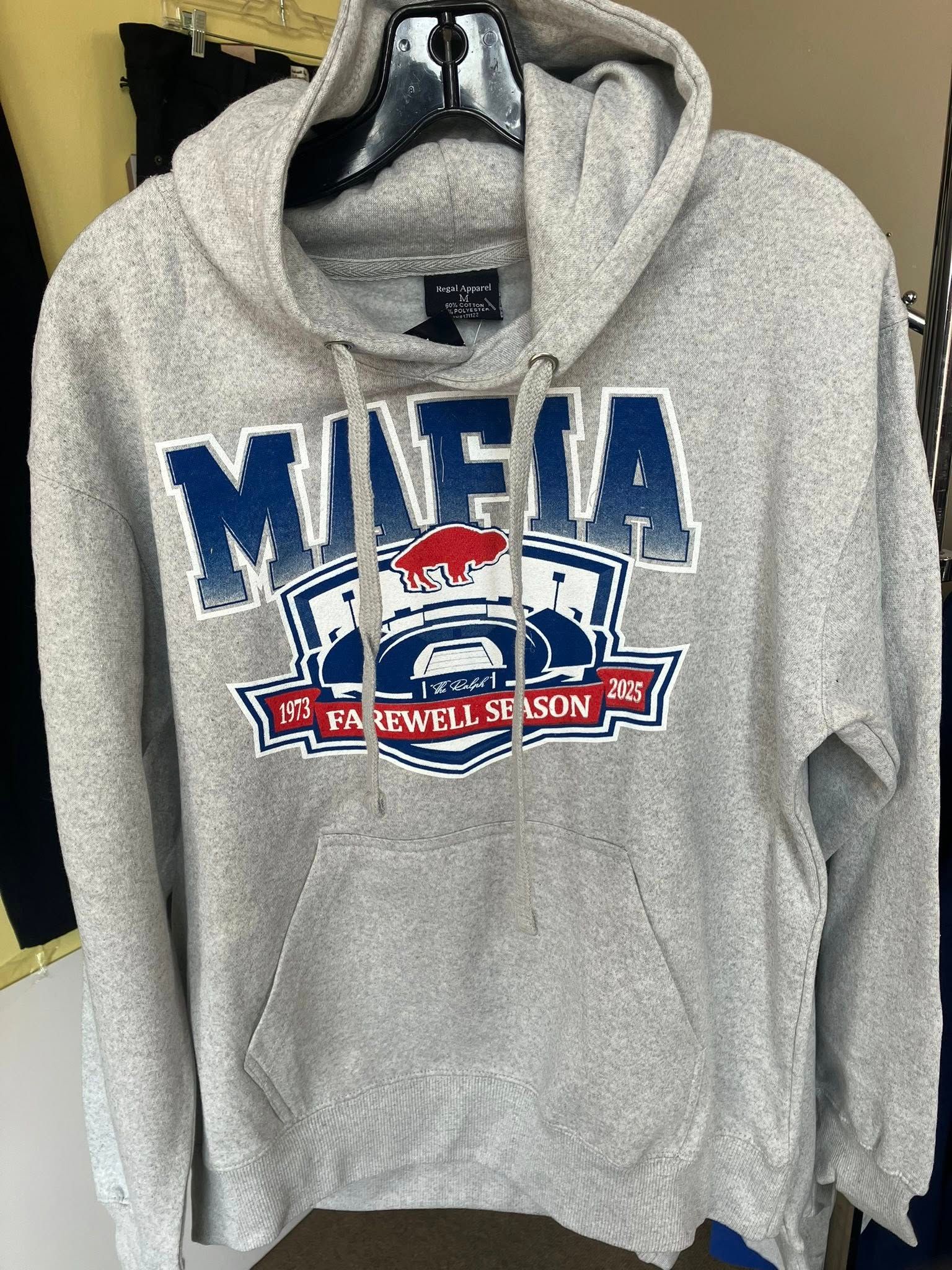 Light gray hooded sweatshirt with a blue and red graphic reading 