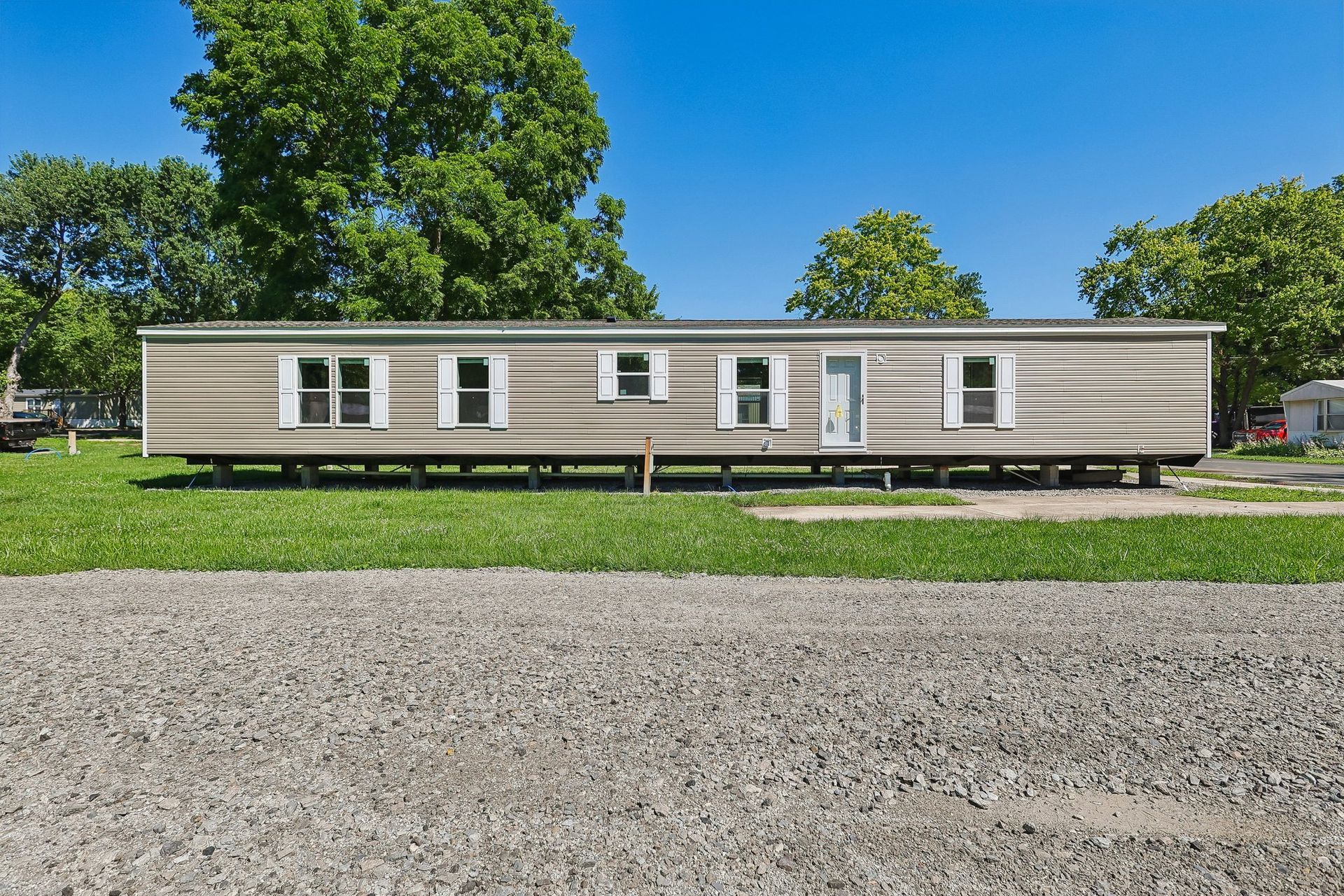 Side view of spacious manufactured home available for sale.