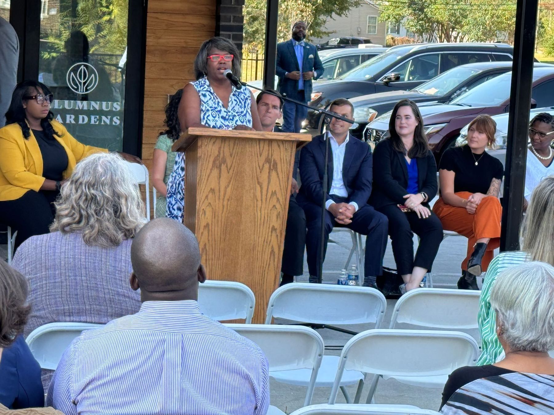 Guests and officials seated for the Alumnus Gardens opening ceremony.