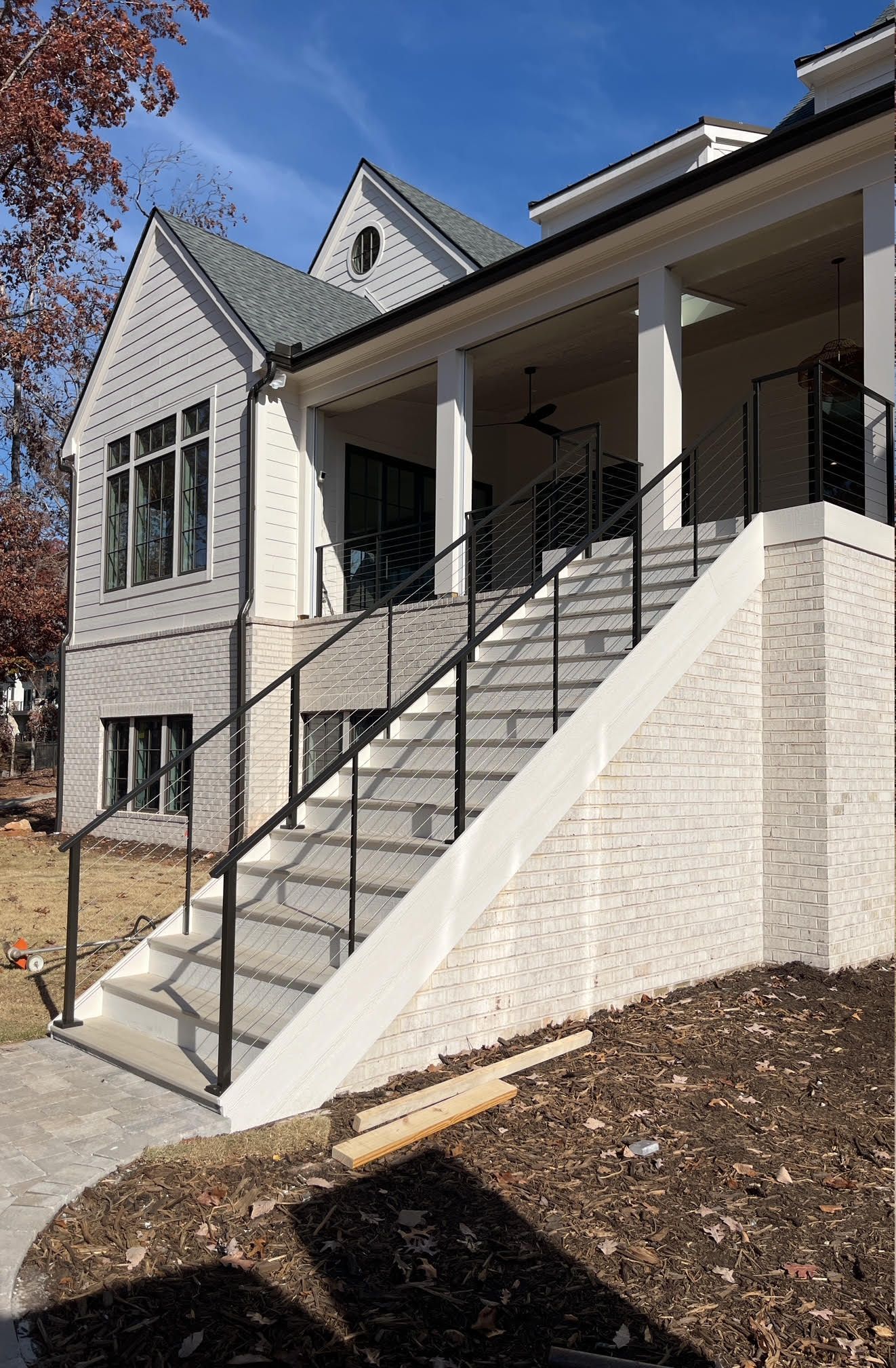 Cable railing staircase and covered porch on a custom home, Greenville SC