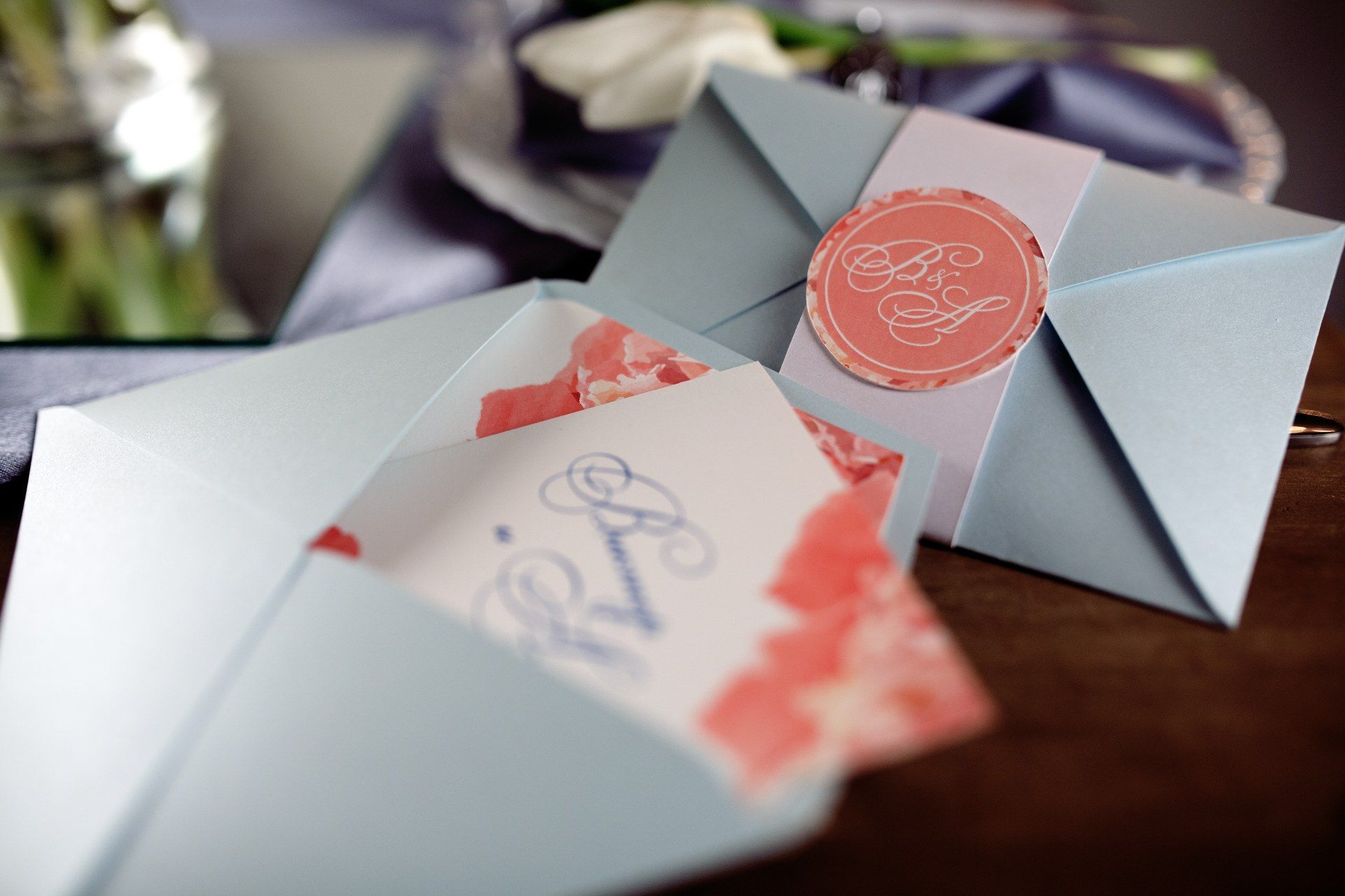 A blue envelope with a rsvp card inside of it