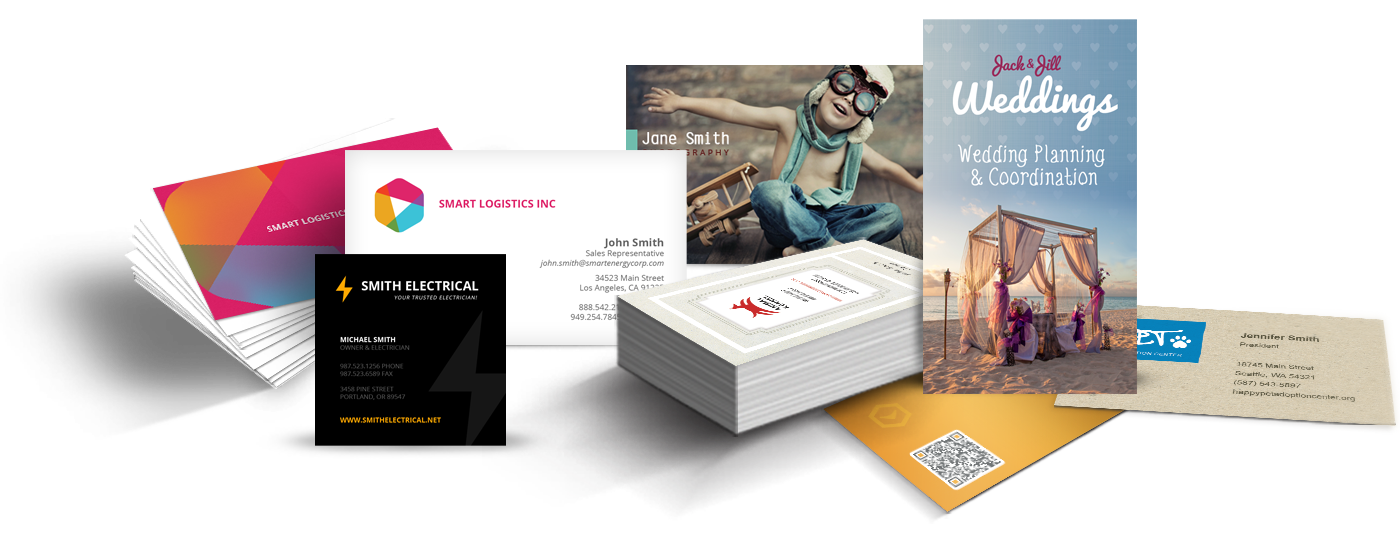 A bunch of business cards are stacked on top of each other on a table.