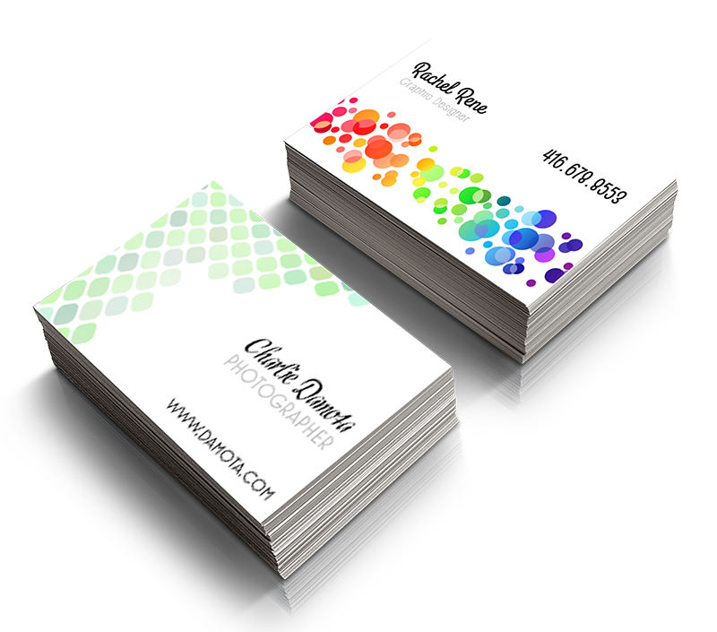 Two business cards are stacked on top of each other on a white surface.
