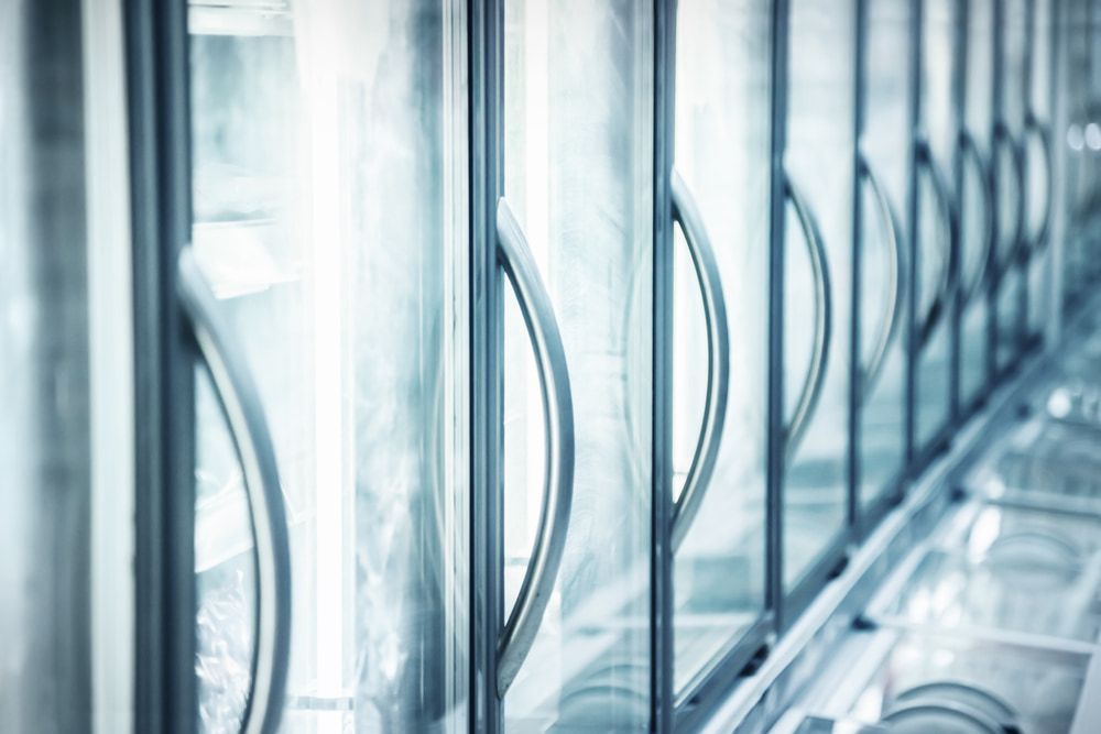 A Row of Refrigerators With Glass Doors in a Store — Noosa Refrigeration & Air-conditioning in Cooroy, QLD