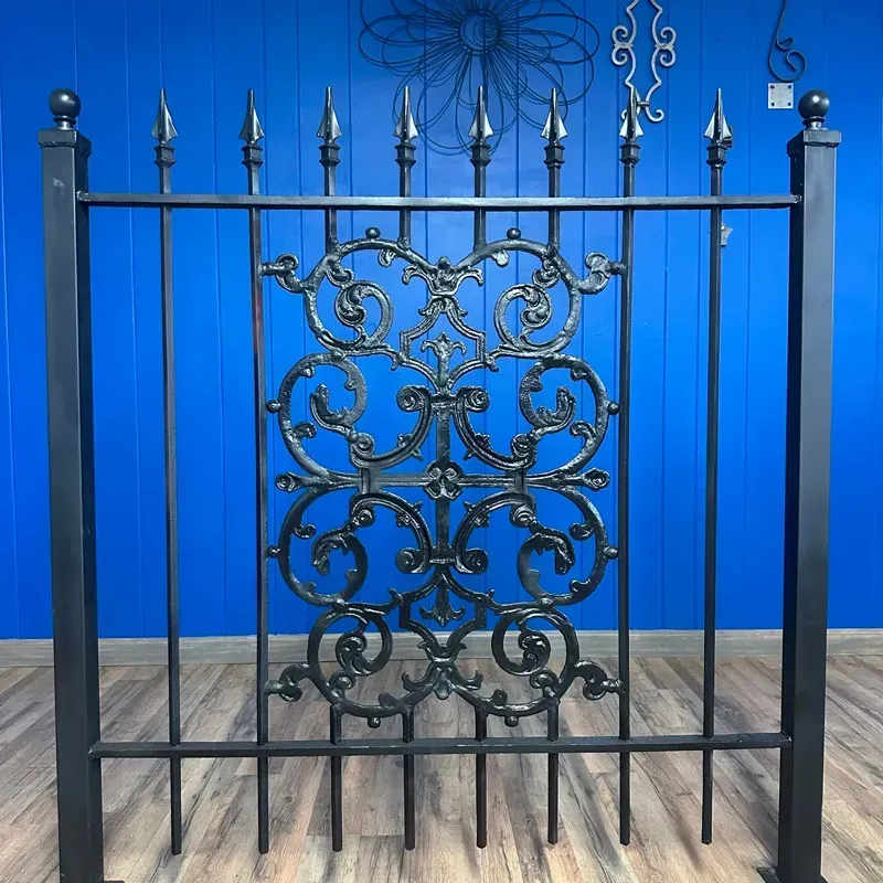 Ornate black wrought-iron gate against a bright blue wall and gray tile floor