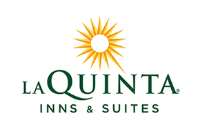 La Quinta Inns & Suites logo: green text, sunburst, white background.