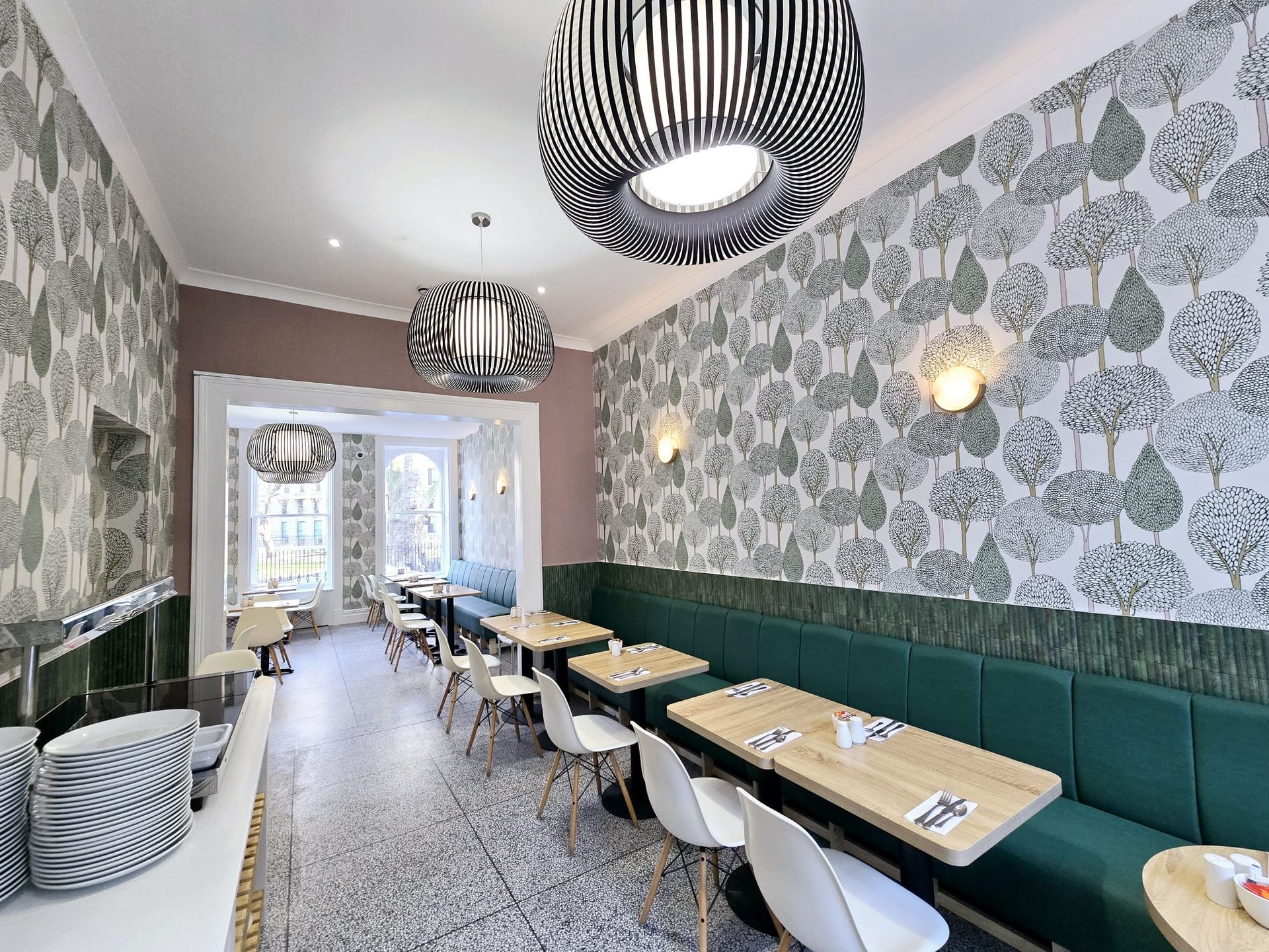 A restaurant with tables and chairs.